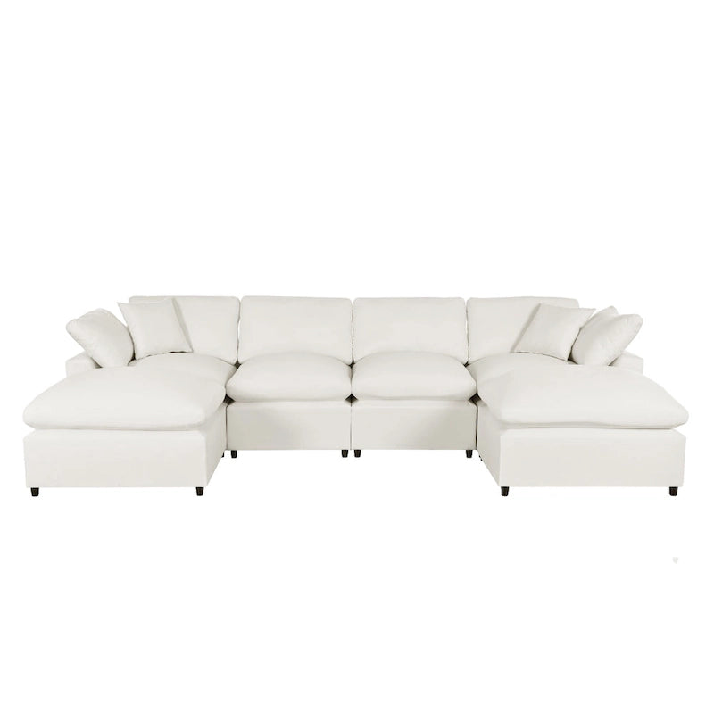 Un grand canapé d'angle moderne en U, doté de deux méridiennes spacieuses et d'un pouf amovible, parfait pour le salon.