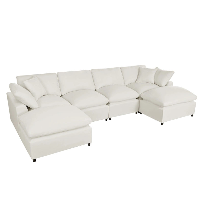 Un grand canapé d'angle moderne en U, doté de deux méridiennes spacieuses et d'un pouf amovible, parfait pour le salon.
