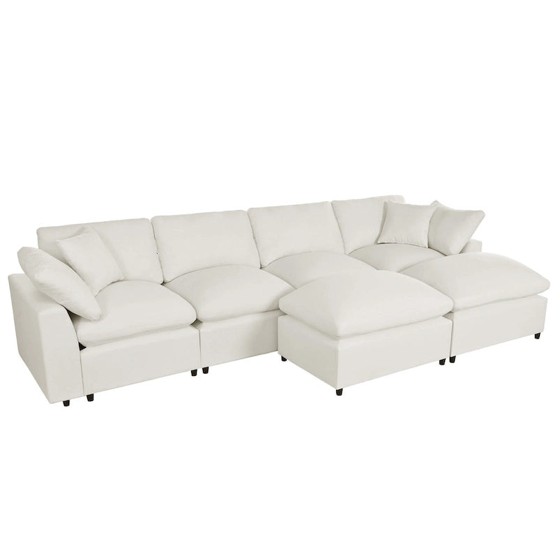 Un grand canapé d'angle moderne en U, doté de deux méridiennes spacieuses et d'un pouf amovible, parfait pour le salon.