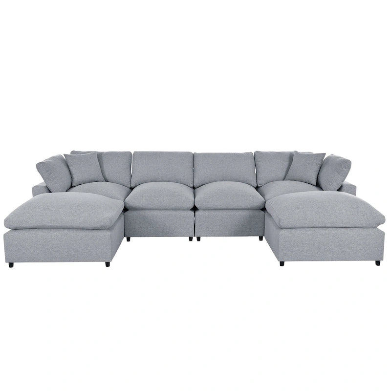 Un grand canapé d'angle moderne en U, doté de deux méridiennes spacieuses et d'un pouf amovible, parfait pour le salon.